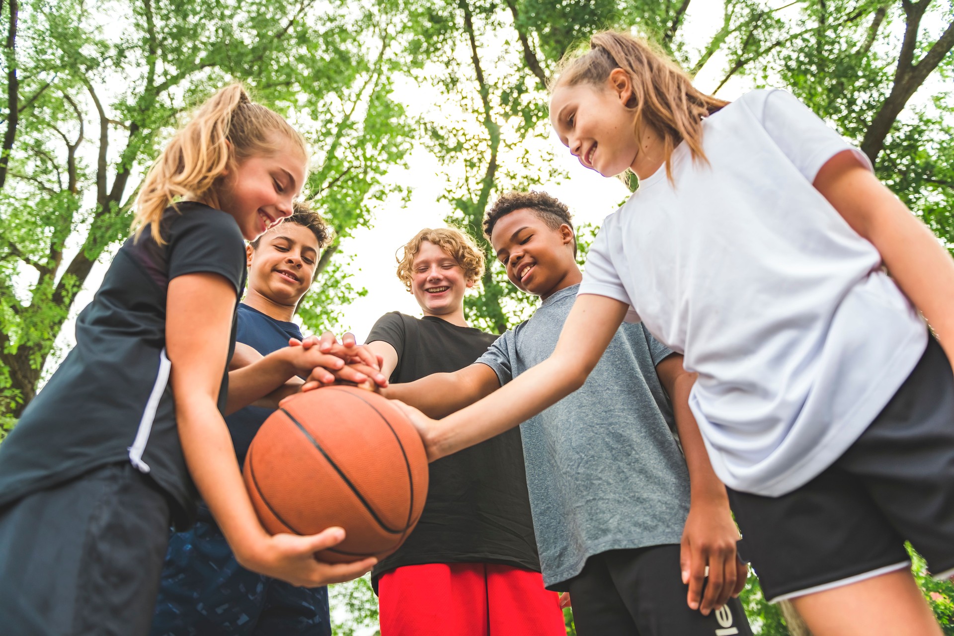 great child Team in sportswear playing basketball game