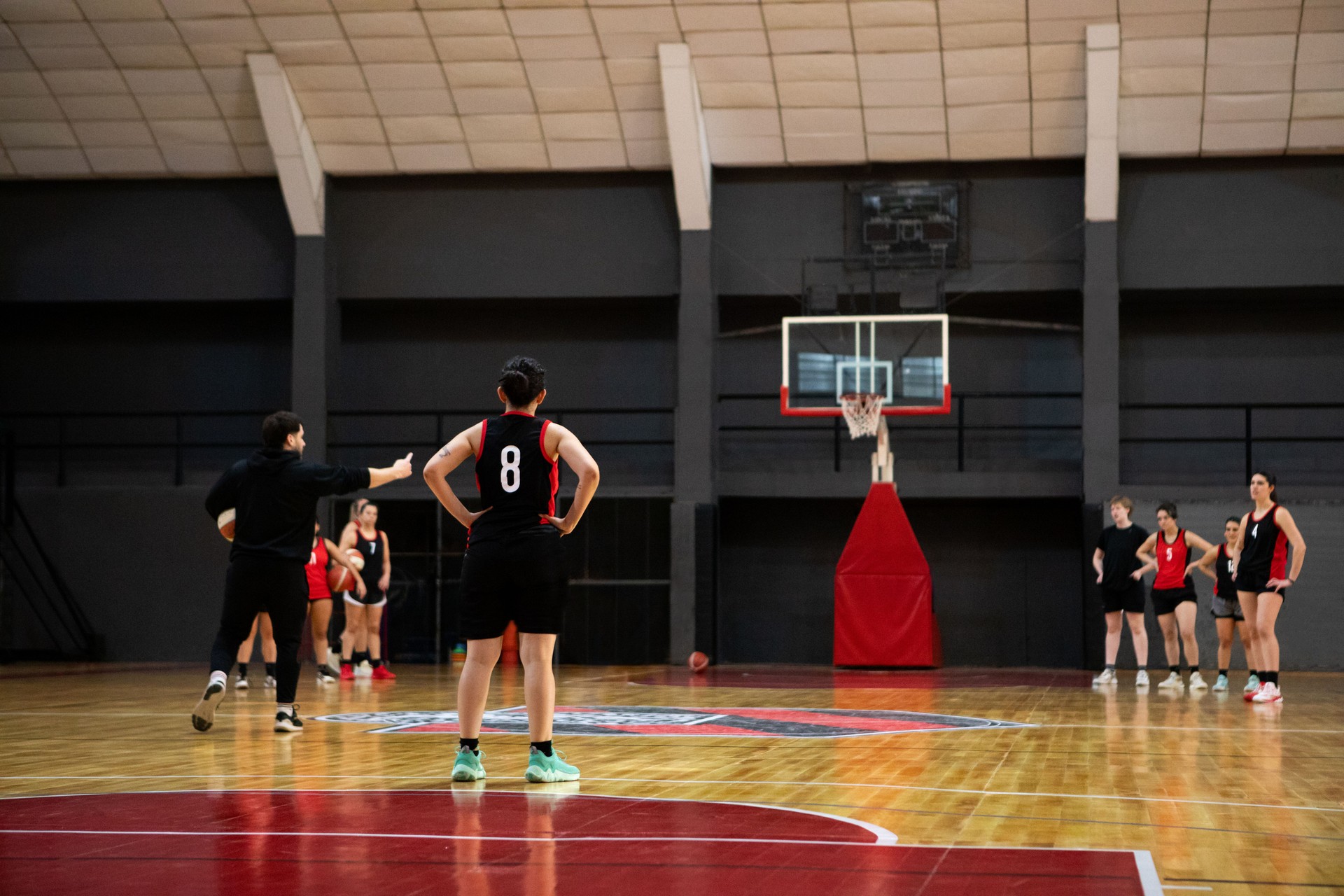 Professional female basketball players having training on indoor court